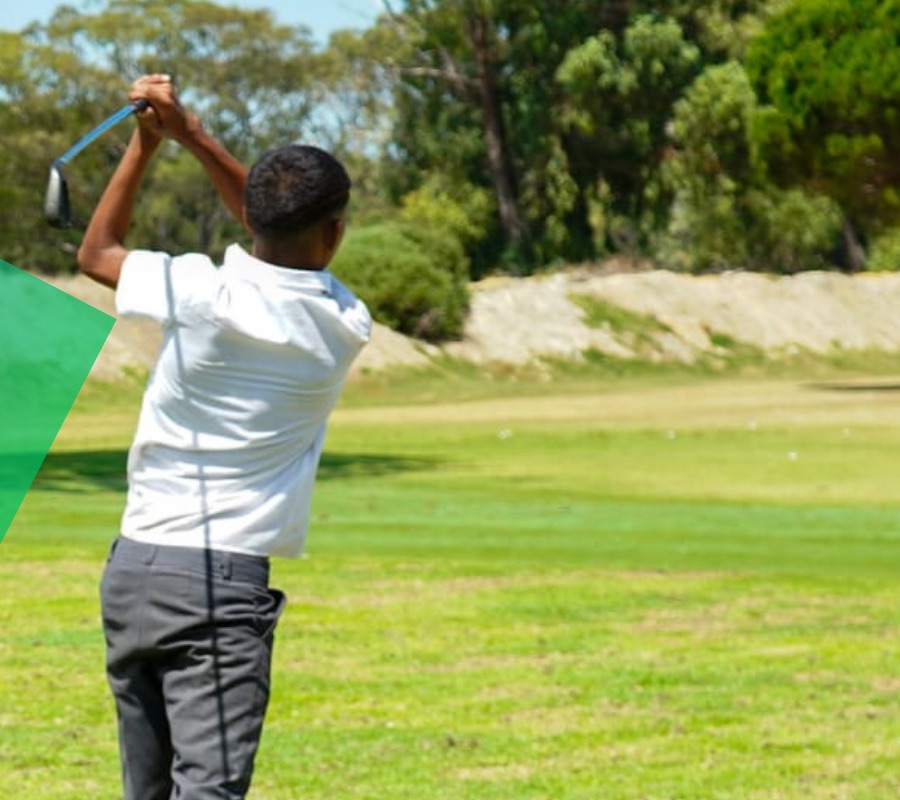 A young Hillwood golfer mid-swing on the fairway