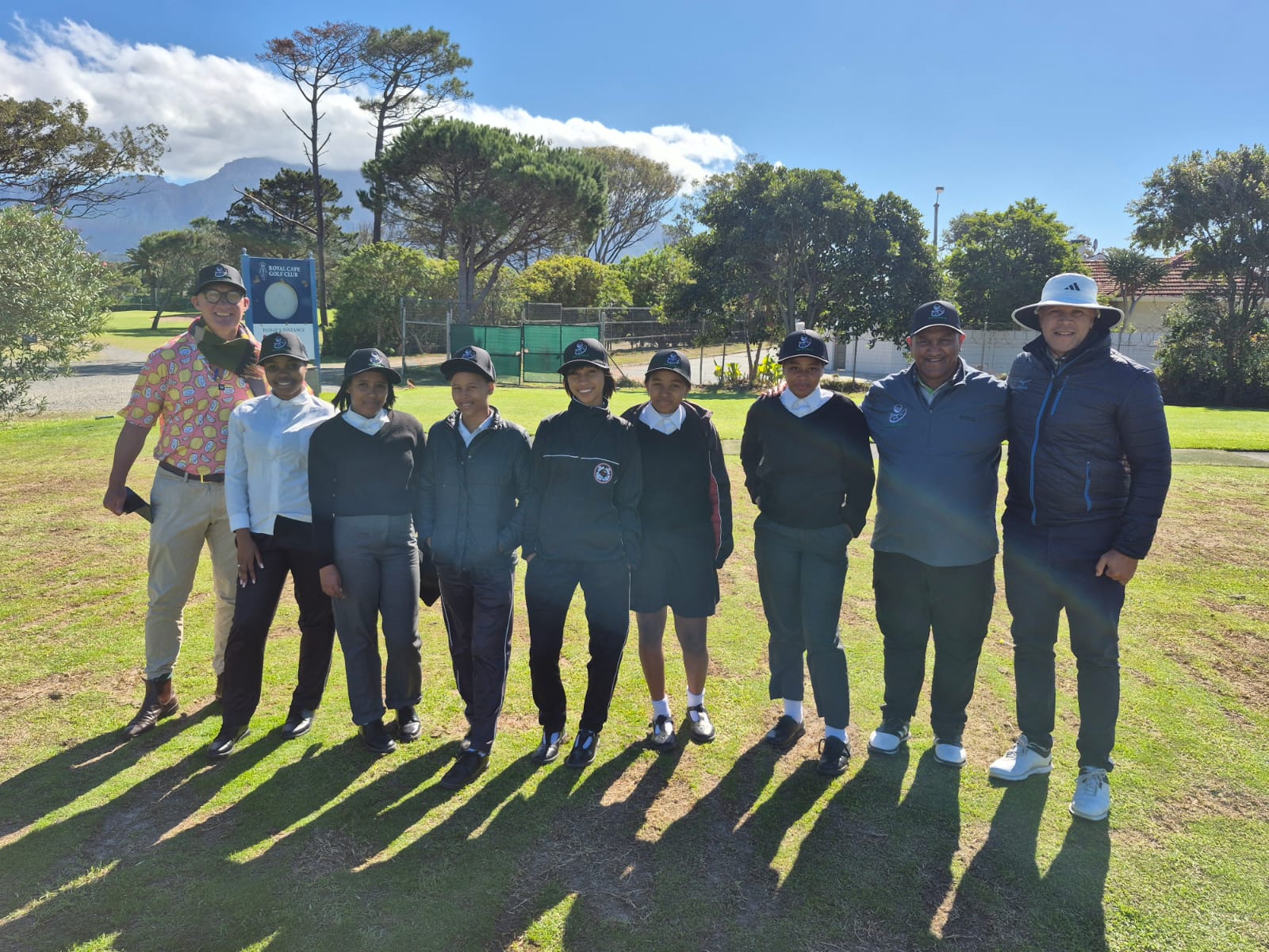 Hillwood Golf Academy students receiving golf caps