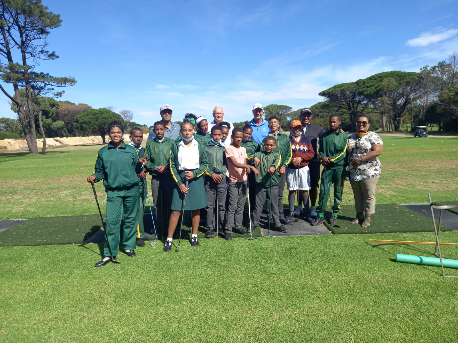 Hillwood Primary School learners and coaches on the practice ground at Royal Cape Golf Club